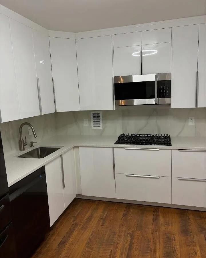 Restored kitchen with white cabinets after water damage in Cutler Bay